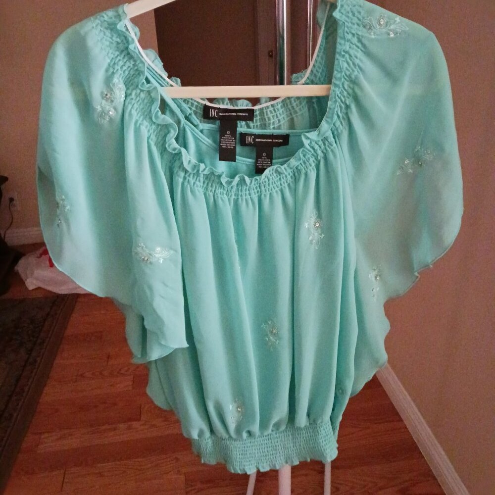 Inc - International Concept Top